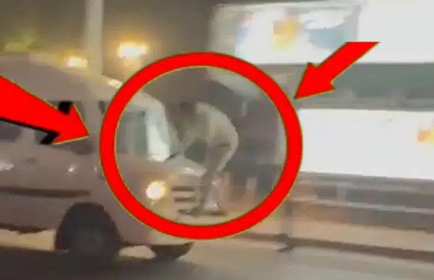 बोनट पर चढ़ा दूध कारोबारी।